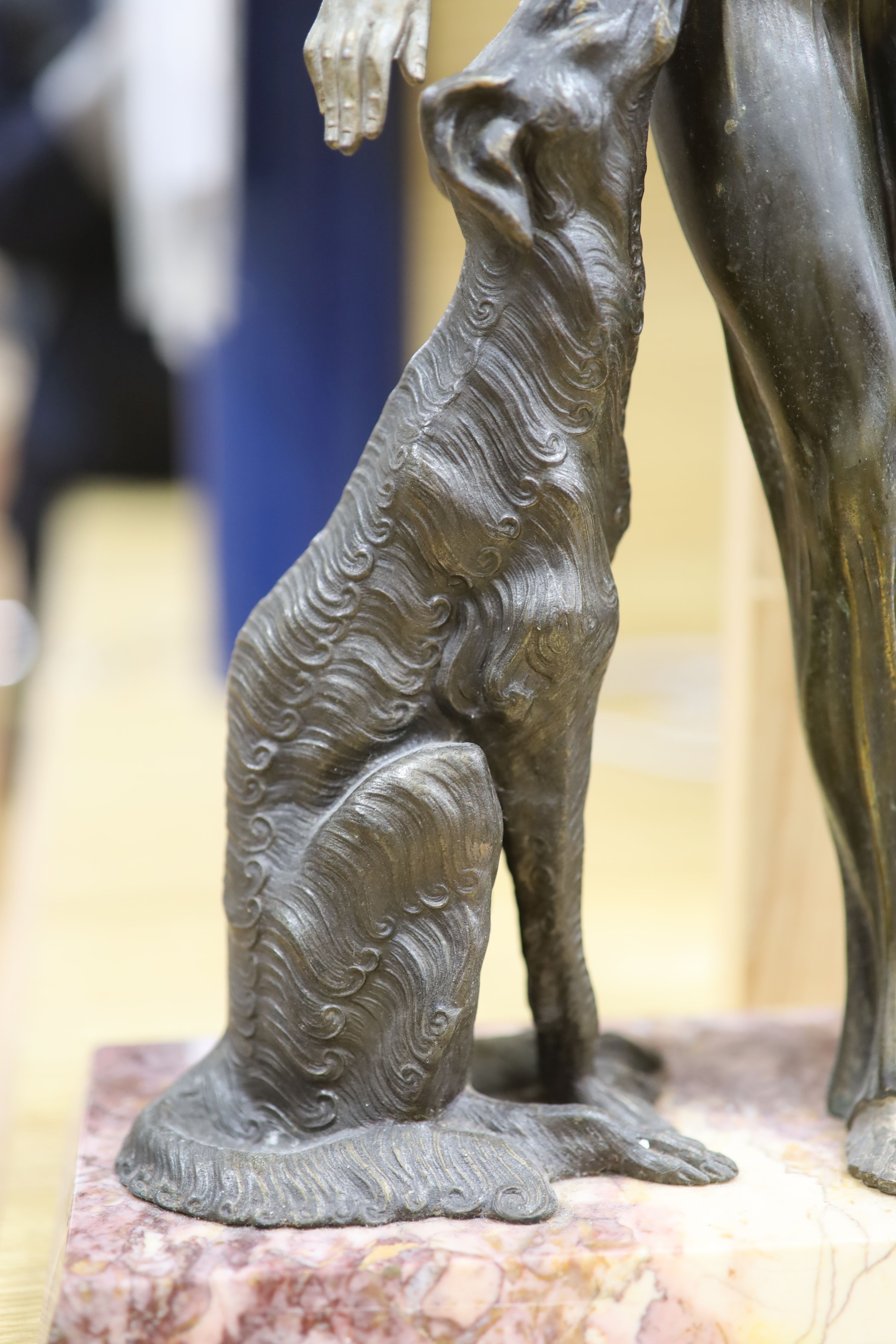 A Spelter Art Deco figure of a dog and borzoi, on a marble base, height 45cm